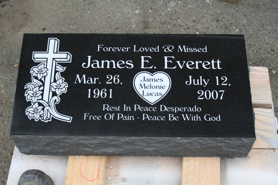 Pillow Grave Marker in absolute black granite. White lettering along